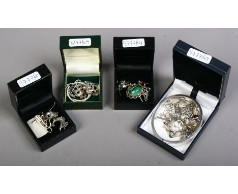 A collection of mixed silver jewellery including a malachite pendant, gem set pendant and earrings and bangle etc.
