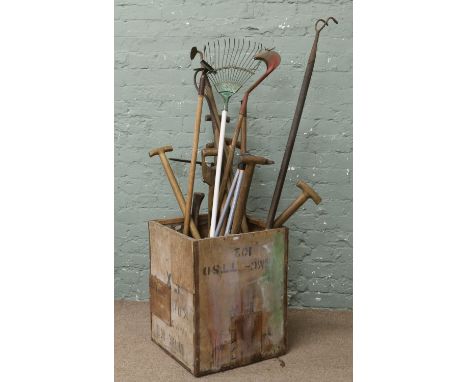 A tea chest and contents of garden tools.
