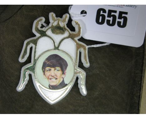 A 1960's (?) Beatles Plastic 'Beetle' Brooch, inset with Ringo portrait.
