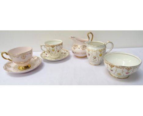 TUSCAN CHINA TEA SERVICE
comprising tea cups and saucers, cake plates and milk jug, with a pale pink ground and gilt decorati