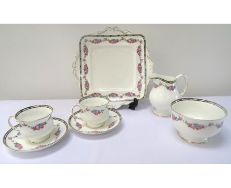 'ROYAL PARAGON' CHINA TEA SERVICE
with gilt and floral decoration on white ground, comprising ten cups, eleven saucers, eleve