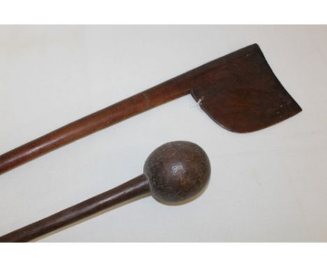 Antique South Sea Island wooden club with axe-shaped wooden blade, tapered shaft with carved geometric decoration tapering to