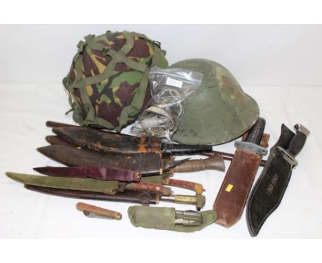 Pair Nazi Army Officers' dagger hangers (one clip broken) and dress knot, lot Eastern and other knives and two helmets