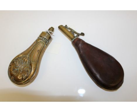 19th century leather shot flask with brass filler neck and measure, together with an embossed coppered brass powder flask, sh