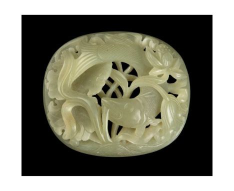 遼至元 青玉雕魚塘荷花'春水紋'橢圓形帶扣 carved in openwork on a domed surface with a large carp swimming in a lotus pond, the stone of even gre