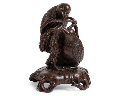 錫祿製底款 沉香木雕雙鳥擺件 carved in round from a whole piece of wood supported on four feet of wooden trunk form, two birds holding a pi