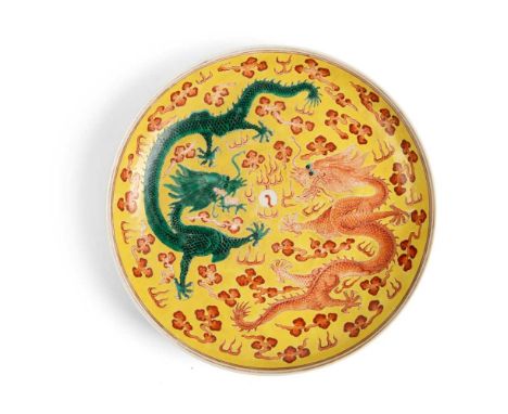 光緒款 黃地粉彩雙龍趕珠紋盤 the interior painted with two five-clawed dragons chasing a flaming pearl amidst ruyi-head clouds, all against