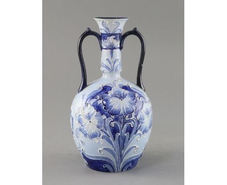 A Moorcroft Florian ware two handled vase, c.1900, decorated with blue and white flowers, brown printed Florian ware mark, gr