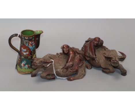 A pair of Chinese wood buffalo groups and a Japanese cloisonne enamel pot