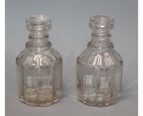 A pair of George IV pillar cut glass decanters, with lenticular effect height 22cm (no stoppers)