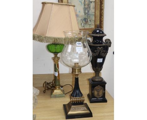 A Victorian style 'oil lamp', a candlestick with storm shade and a faux marble and gilt metal urn (3)