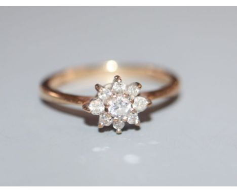 A 9ct gold and diamond cluster ring, size J.