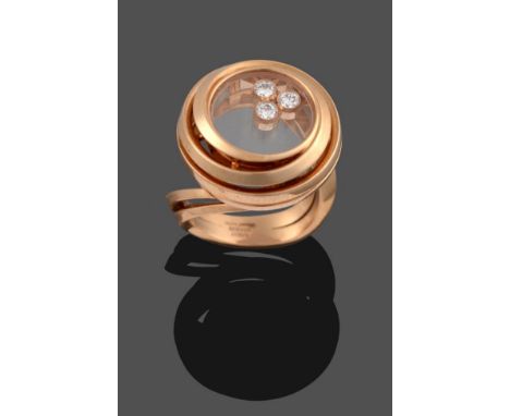 An 18 Carat Rose Gold ''Happy Emotions'' Ring, by Chopard, three collet set 'floating' round brilliant cut diamonds within a 