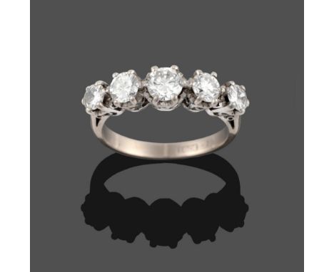 A Diamond Five Stone Ring, the graduated round brilliant cut diamonds in white claw settings, to a tapered shoulder plain pol