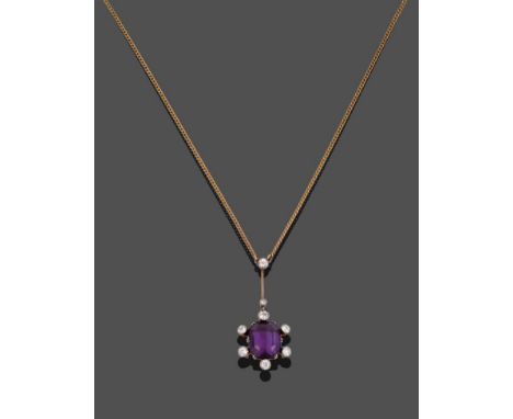 An Amethyst and Diamond Necklace, the pendant drop comprised of an octagonal step cut amethyst with collet set old cut diamon