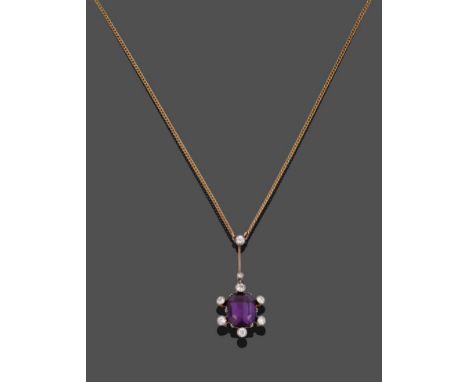 An Amethyst and Diamond Necklace, the pendant drop comprised of an octagonal step cut amethyst with collet set old cut diamon