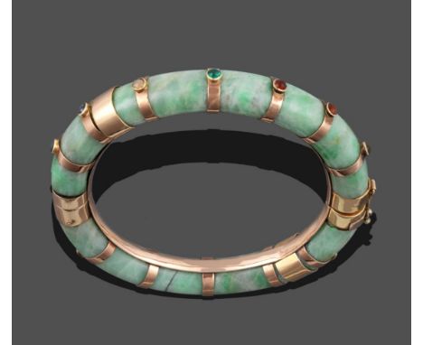 A Jade Bangle, with bands at intervals, each band collet set with a cabochon gem stone, in a box from C&amp;A Giuliano, 48 Kn