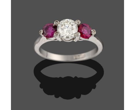 A Ruby and Diamond Three Stone Ring, a round brilliant cut diamond between two round cut rubies, in rose cut diamond set whit