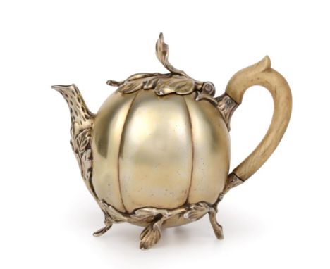 A Dutch Silver-Gilt Teapot, Maker's Mark Rubbed, Probably by Engelbart Joosten, The Hague, 1777, melon-shaped and on foliage 