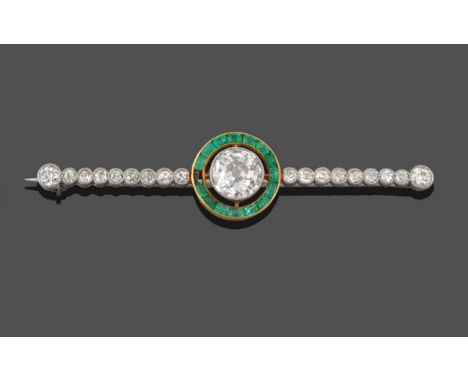 A Diamond and Emerald Bar Brooch, an old cut diamond in a white millegrain setting, spaced to a border of calibré-cut emerald