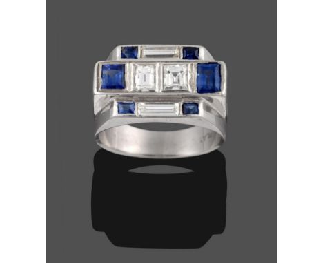 An Art Deco Style Diamond and Sapphire Ring, comprised of three geometric stepped rows, the central row set with two baguette