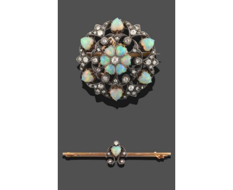 An Opal and Diamond Brooch, circa 1900, comprised of an old cut diamond within six cabochon heart shaped opals, within a fram