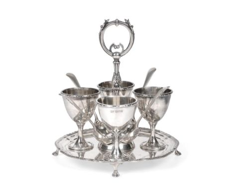 A George V Silver Egg-Cruet, by Harrison Brothers and Howson, London, 1910, on shaped circular stand with beaded border and f