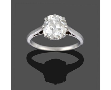 A Diamond Solitaire Ring, the old cut diamond in a white claw setting to a tapered shoulder plain polished shank, estimated d