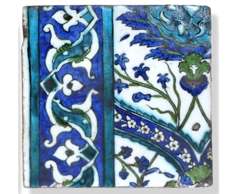 A Damascus Pottery Border Tile, circa 1580, from the same series, with scroll and strapwork border, 23cm by 19.5cm.  4cm flat