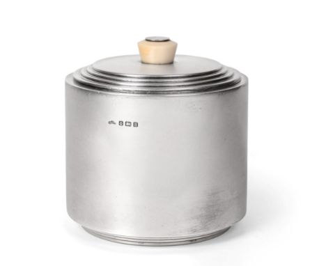 A George V Silver Biscuit-Box, by Asprey, Birmingham, 1932, cylindrical and with stepped base, the stepped pull-off cover wit