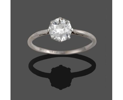 A Diamond Solitaire Ring, a round brilliant cut diamond in a white claw setting, to a tapered shoulder plain polished shank, 