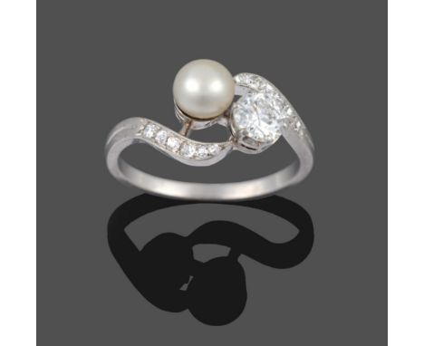 A French Diamond and Pearl Twist Ring, the brilliant cut diamond in white claws, diagonally set to a pearl, with diamond set 