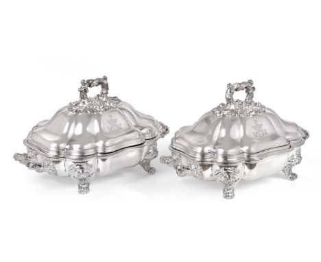 A Pair of Old Sheffield Plate Entree-Dishes, Covers and Stands, With Crown Mark, Circa 1820, each shaped oblong and on four s