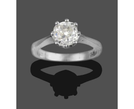 A Diamond Solitaire Ring, an old cut diamond in a white claw setting, to a tapered shoulder plain polished shank, estimated d