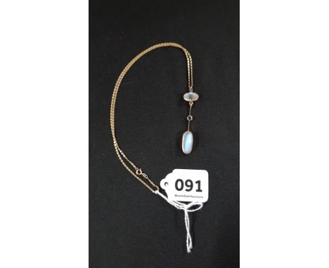 GOLD MOUNTED EDWARDIAN MOONSTONE AND SAPPHIRE DROP ON GOLD CHAIN 