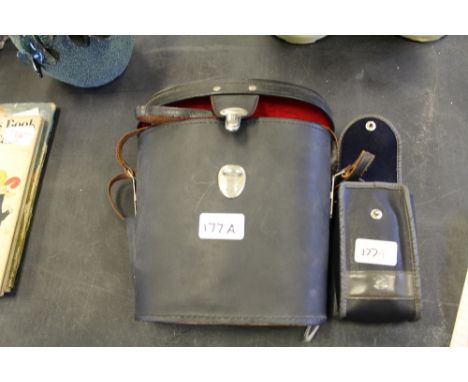 Cased binoculars and camera