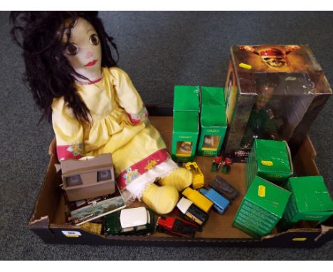 A good mixed lot to include Tetley Tea Folks houses, Corgi diecast trucks, a Pirates of the Caribbean Will Turner Deluxe bobb