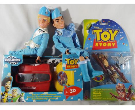 A Disney Pixar Toy Story Viewmaster, boxed, an original Disney Toy Story figure entitled Woody, sealed in blister pack and tw