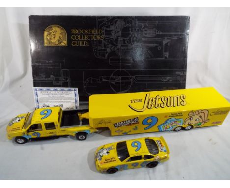 A Jerry Nadeau NASCAR Cartoon Network Jetsons show trailer and car collection by Brookfield Collectors Guild, model No. KP192