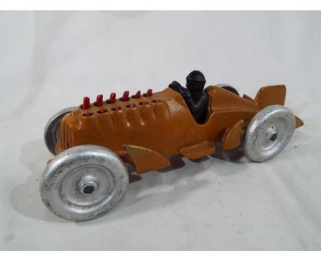 A cast iron model depicting a brown Hubley racing car with driver and moving pistons, approx 26 cm (length) - Est £20 - £40