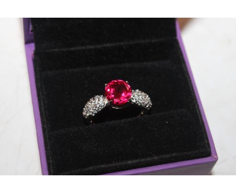 A 925 silver ring set with red and white stones