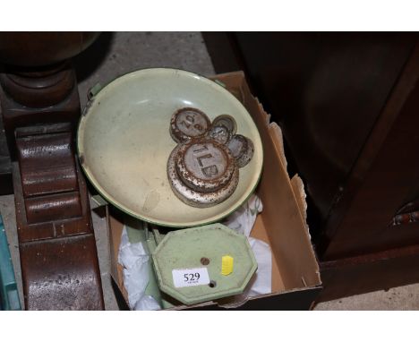 A box containing scales and weights 