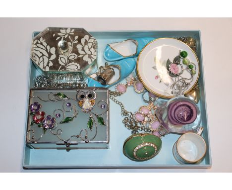 A tray containing trinket boxes, costume jewellery, miniature china items including Spode porcelain slippers, glass paperweig
