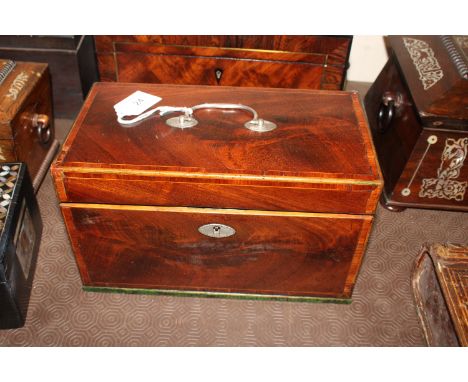 An antique mahogany satinwood cross banded three compartment tea caddy