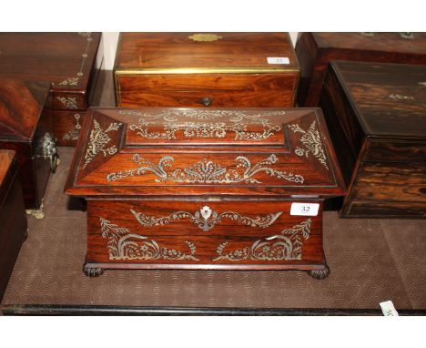 A 19th Century rosewood and mother of pearl inlaid two compartment tea caddy, flanked by ring handles 