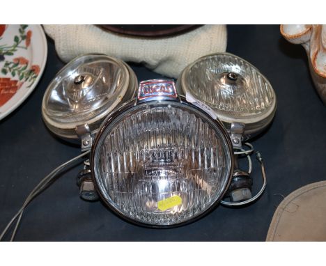 A pair of Wipac spot lights; and a Luca rear mount fog lamp