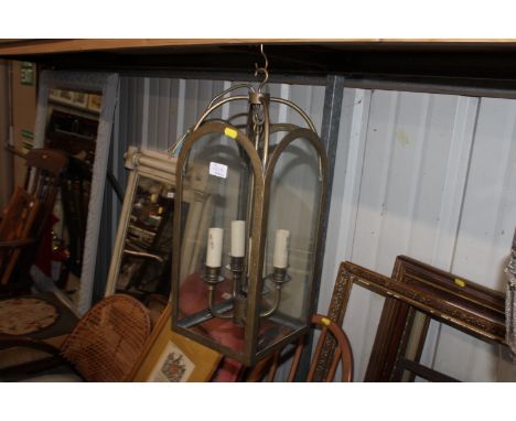 A Jim Lawrence hall lantern in antiqued brass