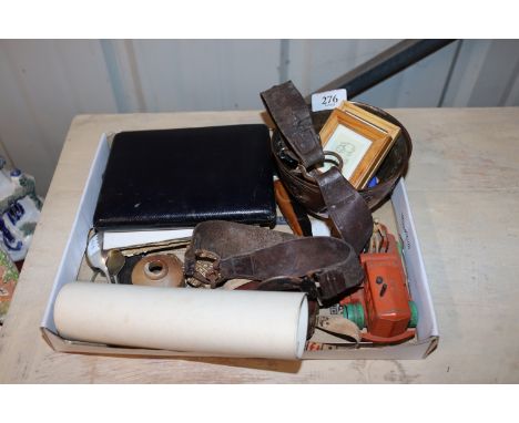 A box of various items to include miniature Winnie-the-Pooh prints; Dinky Supertoys heavy tractor, belt, leather cased tape m