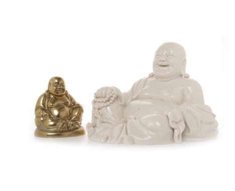 TWO MID/LATE 20TH CENTURY CHINESE BUDDHA FIGURES one blanc de chine ceramic figure, 18cm high; the brass figure, 11cm high (2