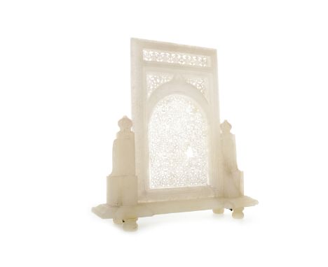 INDIAN ALABASTER TABLE SCREENwith fretwork-type panel with a arch flanked by architectural pillars, 35.5cm high 